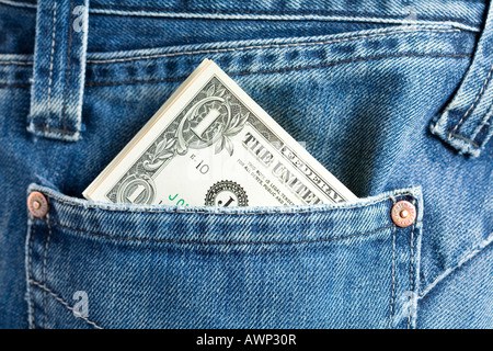 Cash (US dollars) sticking out of a jeans pocket Stock Photo