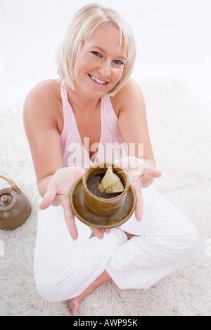 woman holding teapot Stock Photo