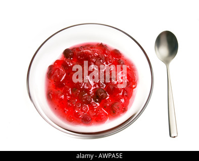 jam of red CRANBERRIES berries on white background in glass plate bowl Stock Photo