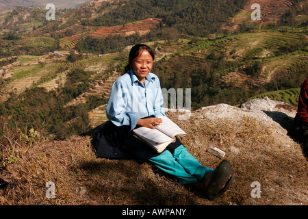 Schoolgirl wearing school uniform in the countryside near Nagarkot, Nepal, Asia Stock Photo