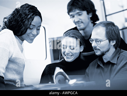 Business people examining book, blue tone Stock Photo