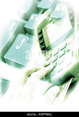 Hand on credit card machine, and computer keyboard, superimposed pictures, close-up Stock Photo