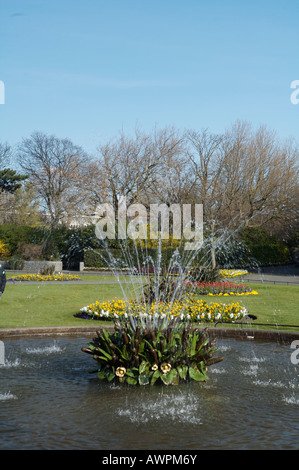A fountain in St. Stephen's Green park in Dublin Ireland with a pond beneath it Stock Photo