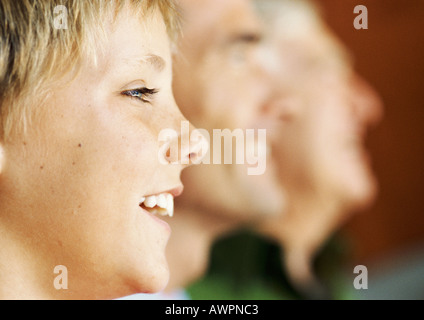 Grandfather, father and son, side view, focus on son Stock Photo