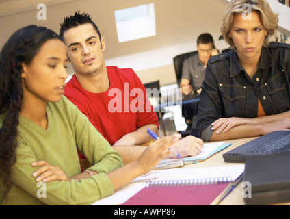 Co-workers having meeting in office Stock Photo