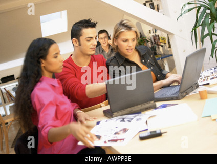 People working with laptops in office, close-up Stock Photo