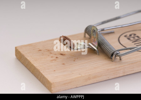 Wooden mousetrap baited with chocolate Stock Photo