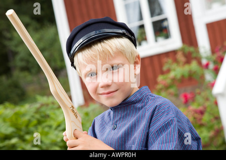 Boy dressed as a literary character at film shooting location and former home of Astrid Lindgren in Katthult/Gibberyd, Sweden,  Stock Photo