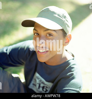Portrait of teenage boy wearing hat and smiling Stock Photo