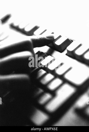 Hand on computer keyboard, close-up Stock Photo