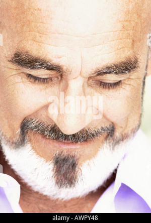 Mature man smiling, eyes closed, close-up. Stock Photo