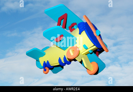 Concept image of 1 toy aeroplane in the sky. Stock Photo