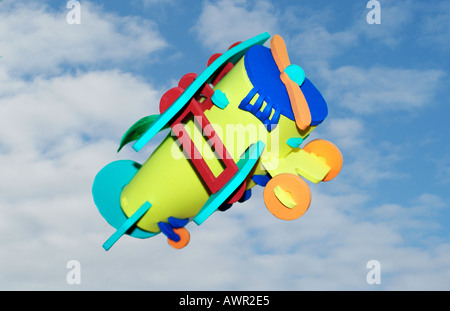 Concept image of 1 toy aeroplane in the sky. Stock Photo