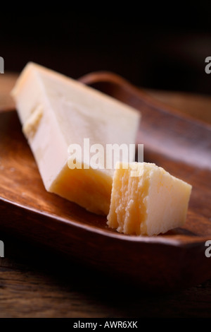 Parmesan cheese in a wooden bowl Stock Photo