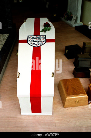 Coffin in undertakers showroom finished in colours of England national flag for a die hard football fan London Stock Photo