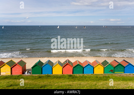 Coloured beach huts on Whitby Sands, Whitby, North Yorkshire Stock Photo