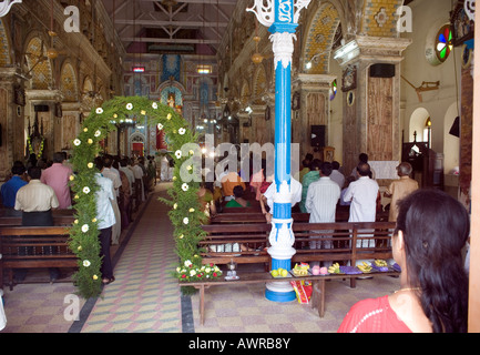 Indian Believers attending a prayer sevice in Santa Cruz Basilica Fort Kochi.  Fort Cochin, Kerala, South India Stock Photo