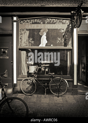 Black and white photography - Bicycle parked outside a traditional Dutch Street Cafe Amsterdam the Netherlands Stock Photo