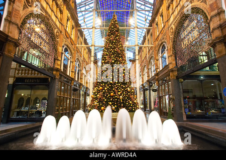 Fountain and Christmas tree in Victoria Quarter Shopping Arcade at Christmas Leeds Yorkshire UK Stock Photo