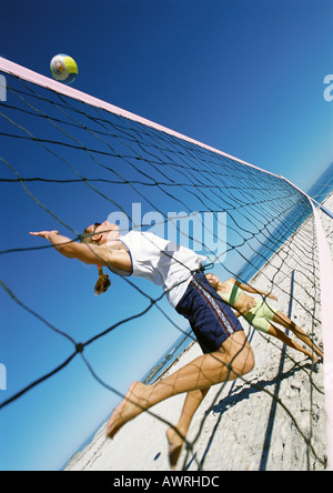 Two young women playing beach volleyball rear view Stock Photo: 6543080