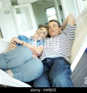 Mature couple lying in a hammock Stock Photo