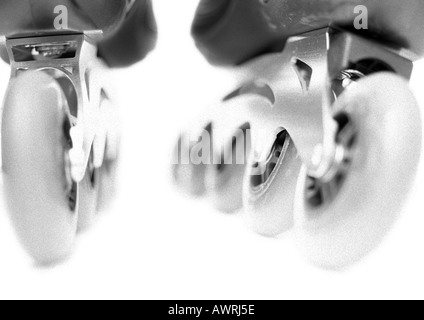 In-line skate, close-up of wheels, b&w. Stock Photo