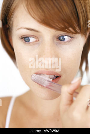 Woman brushing teeth, close-up Stock Photo