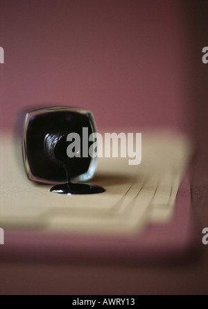 Spilt bottle of black nail polish Stock Photo