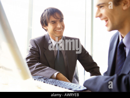 Businessmen laughing together, head and shoulders Stock Photo