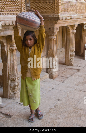 Portrait of a young girl carrying a water jug in Jaisalmer, Rajasthan, India. Stock Photo