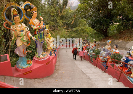 dh Ten Thousand Buddhas Monastery SHATIN HONG KONG Lady and girl on steps to upper temple colourful painted statues tourist