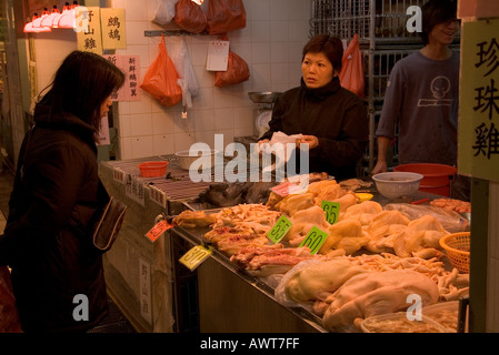 dh Tai Po Market Poultry stall TAIPO HONG KONG Shop customer woman trader people china shopping food Stock Photo