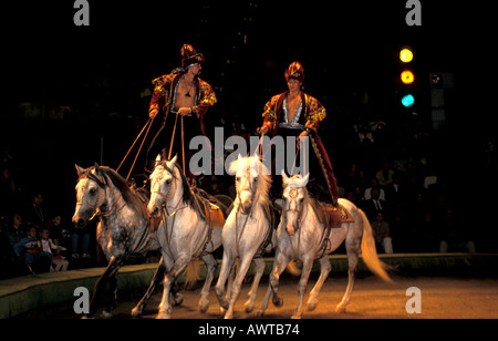 Moscow Russia New Circus Performers Standing on Horses Stock Photo