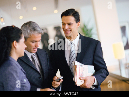 Group of business people talking together, waist up Stock Photo