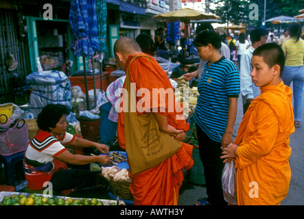 Thai people, Buddhist monks shopping, Buddhist monks, shoppers, shopping, market, Chiang Mai, Chiang Mai Province, Thailand, Southeast Asia, Asia Stock Photo