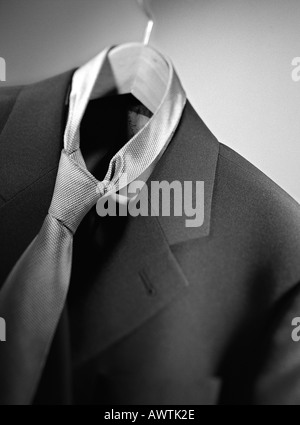 Suit jacket with tie on hanger, close-up Stock Photo