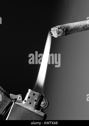 Lighter lighting cigarette, close-up Stock Photo