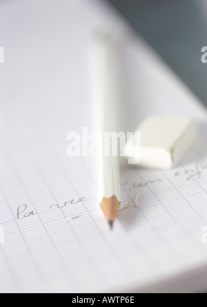 Notebook, pencil and eraser, close-up Stock Photo