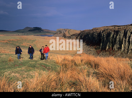 A family walk at Steel Rigg, a popular location on Hadrian's Wall National Trail in Northumberland National Park Stock Photo