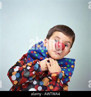 Boy dressed up as clown Stock Photo