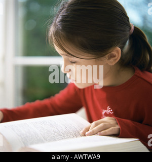 Girl reading book Stock Photo