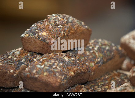 organic wholemeal poppy and sunflower seeded seed bread on sale at a farmers market in belfast Stock Photo