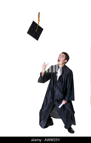 Graduate Throwing Cap in the Air Stock Photo