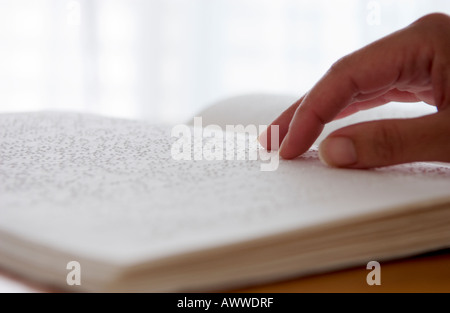 blind person reading braille Stock Photo