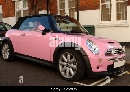 Pink Austin Mini Cooper S, nicknamed Alice Cooper at a Mini Car Owners'  Club exhibition with matching accessories in the boot Stock Photo - Alamy