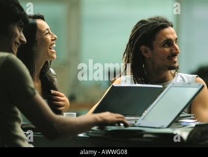 Men and woman working and laughing together Stock Photo