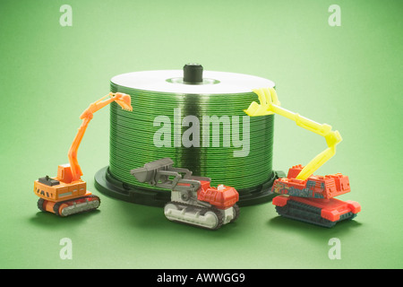 CD Spindle with Miniature Construction Machines Stock Photo