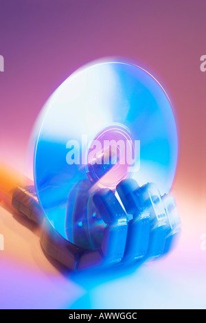 Toy Robot Hand Holding CD Stock Photo