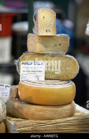 award winning gouda style mossfield organic irish cheese selection at an indoor market Stock Photo