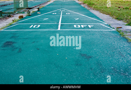 Hopscotch triangle on a green paved area. Stock Photo